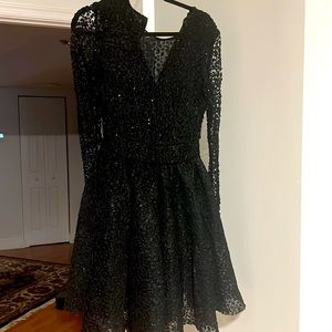 This dress is a size 2 but it fits as a size 4 as well.